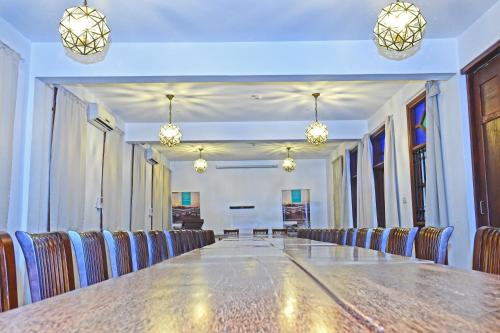 a large conference room with a long table and chairs at Maru Maru Hotel in Zanzibar City