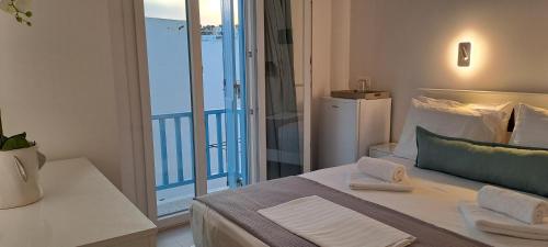 Ένα ή περισσότερα κρεβάτια σε δωμάτιο στο Dinas Inn 