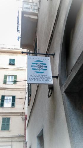 a sign hanging on the side of a building at L'Approdo Dell'Ammiraglio in La Spezia