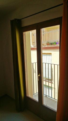 an open door with a view of a balcony at Apartments Luna 19 in Alcañiz