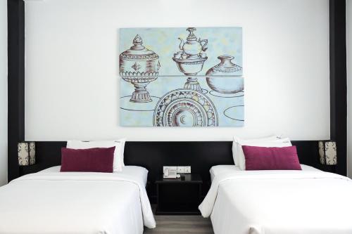 Una cama o camas en una habitación de Apsor Palace Hotel