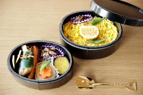 two bowls of food sitting on a wooden table at Fairfield by Marriott Tochigi Nikko in Nikko