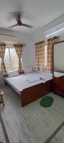 Postel nebo postele na pokoji v ubytování Regencyy Guest House