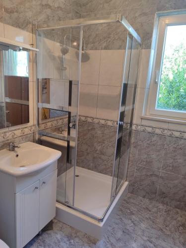 a bathroom with a shower and a sink at Apartments Nikola in Pučišća