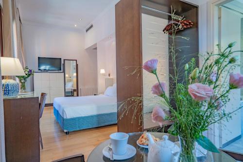 Postel nebo postele na pokoji v ubytování Residenza San Marco " La Padrona"