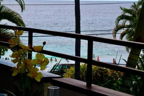 a view of the beach from a balcony at Direct oceanfront Magic Sands beach condo - Pool, AC, 2B2B, sleeps 6 in Kailua-Kona