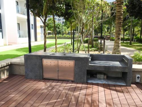 a bath tub sitting on top of a patio at TimurBay Seafront Residence Kuantan in Kuantan