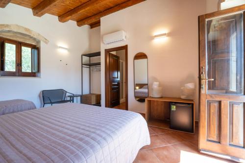 Кровать или кровати в номере Agriturismo Masseria sul Mare