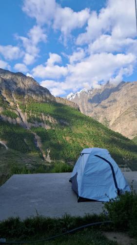 a blue tent sitting on top of a mountain at Shiva Homestay in Gondla