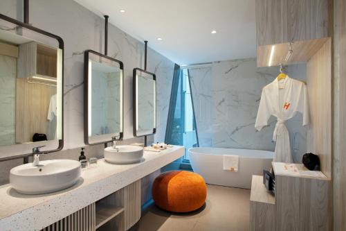 Koupelna v ubytování HARRIS Hotel & Convention Cibinong City Mall Bogor