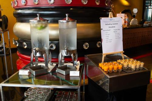 a table with two large pitchers of orange juice at lebua at State Tower in Bangkok