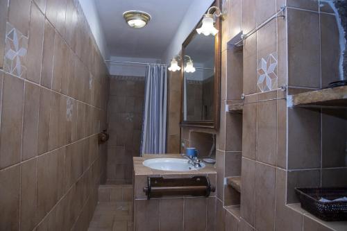 a bathroom with a sink and a mirror at La Limonaia a mare in Ponza