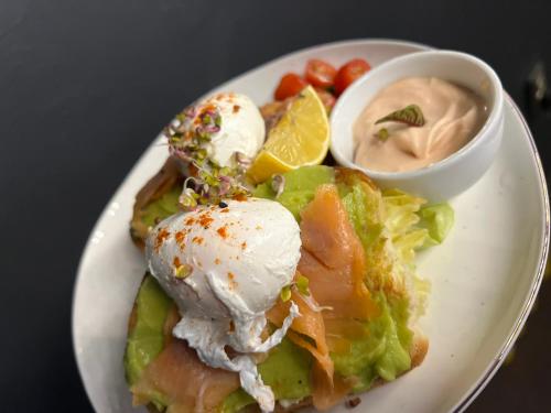 a plate of food with an ice cream and a salad at Casa Mignon in Oradea