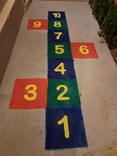 a drawing of a race track on a sidewalk at CASA Di TRE MARE in Nea Kalikratia