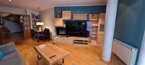 a living room with a large flat screen tv at Dúplex Luxury Alfaro in Alfaro