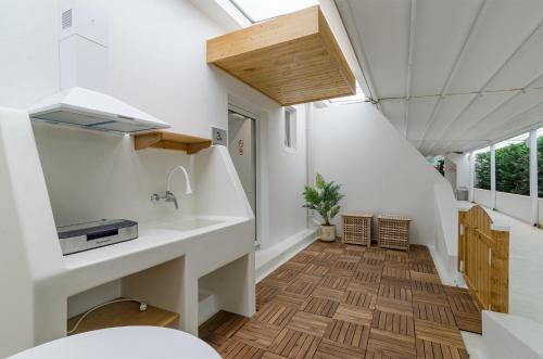 a small house with a sink and a hallway at Villa Kalimera in Balchik