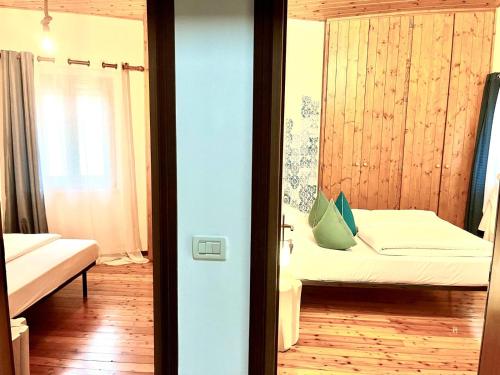 Postel nebo postele na pokoji v ubytování Sleep In Venzone