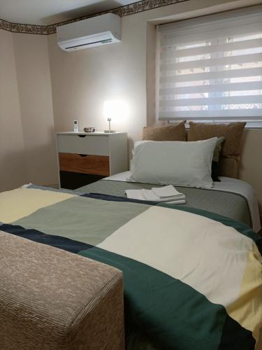 a bedroom with a large bed with a window at Casa dei Sofisti in Lentini