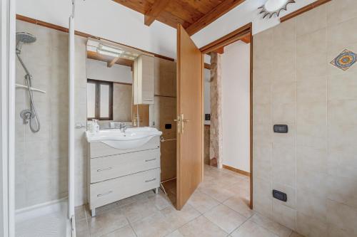 a bathroom with a sink and a shower at Casa rustica in Gonnesa