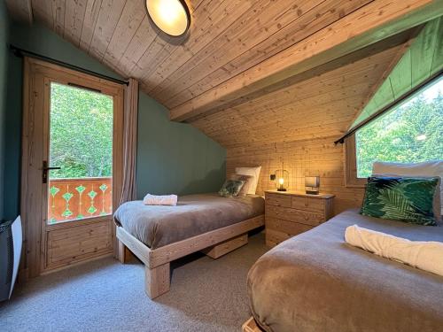 Ένα ή περισσότερα κρεβάτια σε δωμάτιο στο Chalet Tamara Clés Blanches Courchevel