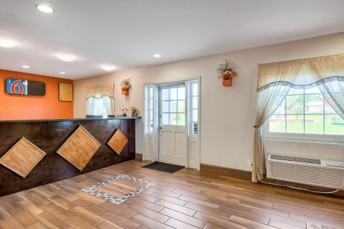 a living room with a door and a window at Motel 6-Harrisonburg, VA - South in Harrisonburg