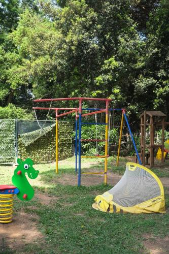 a park with a playground with a play equipment at Residence Ristorante Il Paradiso in Guardistallo