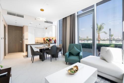 a living room with a couch and a table at Your Keys Holiday Homes in Dubai