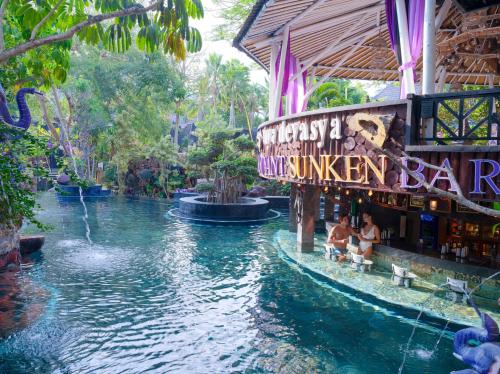 a swimming pool in a resort with a water park at Hiker's Camp at Toya Devasya in Kintamani