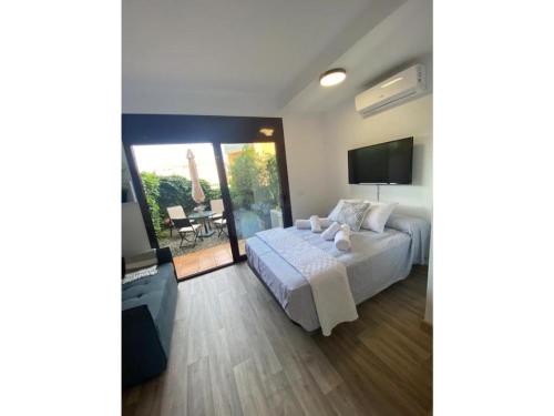 Ένα ή περισσότερα κρεβάτια σε δωμάτιο στο Apartamento-loft, Lloret De Mar