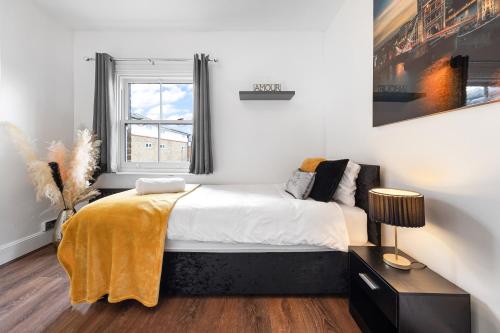 a bedroom with a bed and a window at The Hogwarts Retreat - Cinema Room - in Watford
