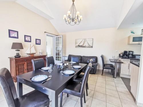 a dining room with a table and chairs at Holiday Home St Pierre by Interhome in Saint Malo