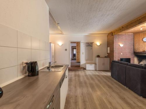 a kitchen with a sink and a counter top at Apartment Eifelnatur - Haus 2-2 by Interhome in Immerath
