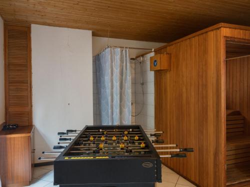 a room with a pool table in a room at Apartment Eifelnatur - Haus 2-2 by Interhome in Immerath