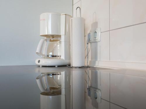 a coffee maker sitting on a counter in a kitchen at Apartment Eifelnatur - Haus 2-1 by Interhome in Immerath