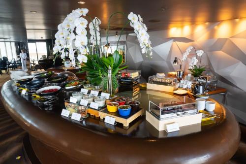 a table with food on it in a room at Tower Club at lebua in Bangkok