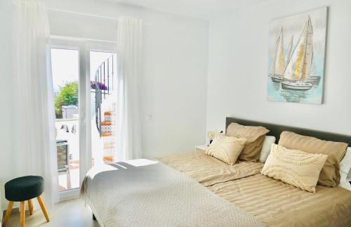 Ένα ή περισσότερα κρεβάτια σε δωμάτιο στο Casa Alegría Nerja