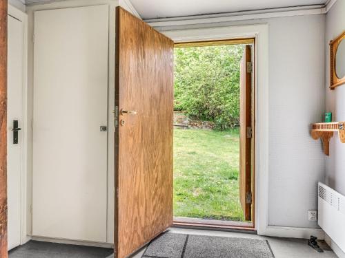 an open door with a view of a yard at Holiday Home Alice by Interhome in Tällberg