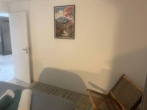 a living room with a picture on the wall at Le Jacquier Life House in Saint-Pierre