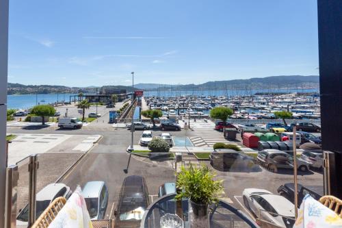a view of a parking lot with a marina at PISO EN COMBARRO A 1º LINEA DE COSTA in Combarro