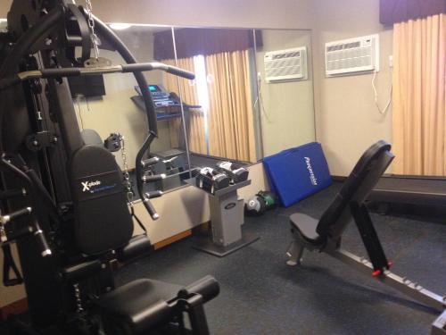 a room with a gym with a treadmill at Days Inn by Wyndham Sylvan Lake in Sylvan Lake