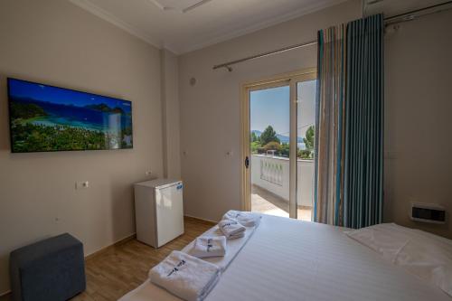 Postel nebo postele na pokoji v ubytování Vila Vasili