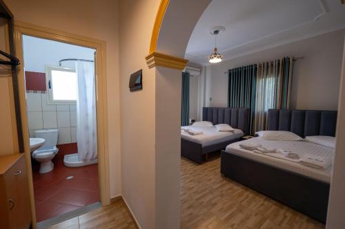 Postel nebo postele na pokoji v ubytování Vila Vasili