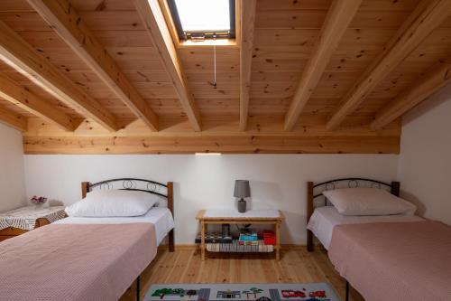 Postel nebo postele na pokoji v ubytování Pratsas House