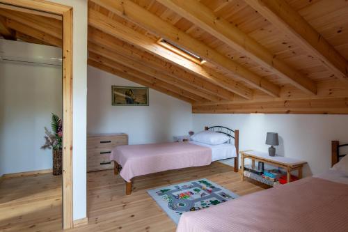 Postel nebo postele na pokoji v ubytování Pratsas House