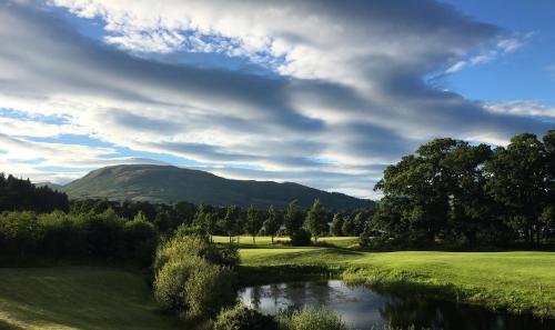 a view of a river with a mountain in the background at Cameron House on Loch Lomond in Balloch