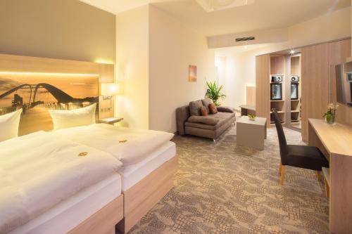 Postel nebo postele na pokoji v ubytování Best Western Hotel Dreiländerbrücke Weil am Rhein / Basel