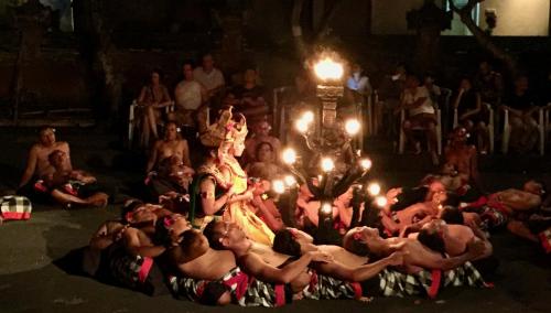 a group of people in a circle with torches at Villa Kaniksa in Candidasa