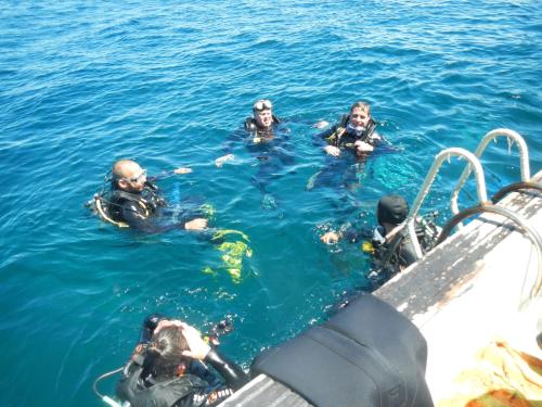 a group of people in the water on a boat at Villa Kaniksa in Candidasa