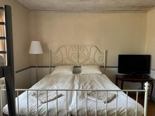 Postel nebo postele na pokoji v ubytování Hallagårdens B&B