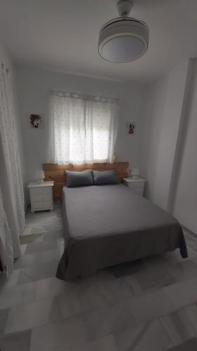 Postel nebo postele na pokoji v ubytování Brisas del Guadalquivir